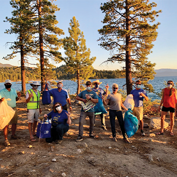 The Tahoe-Douglas Rotary Club “Blue Bandits” Crew flex after a successful cleanup at Zephyr Shoals. Photo credit: Tahoe-Douglas Rotary.